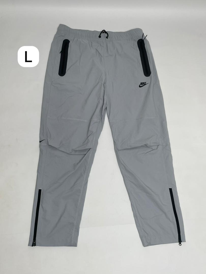 Pantalon Nike Tech Homme Gris Détails Noirs Zippé