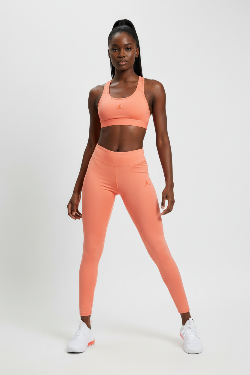 Mannequin femme portant le legging Jordan orange corail - vue de face