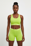 Mannequin africaine portant la brassière Nike Pro vert citron - Vue de face